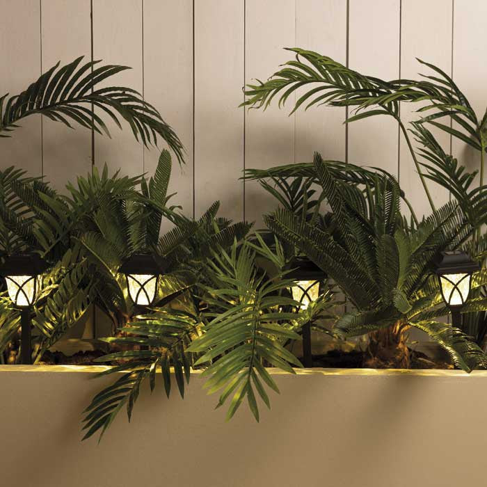 Set de 4 postes solares para jardín, luz cálida